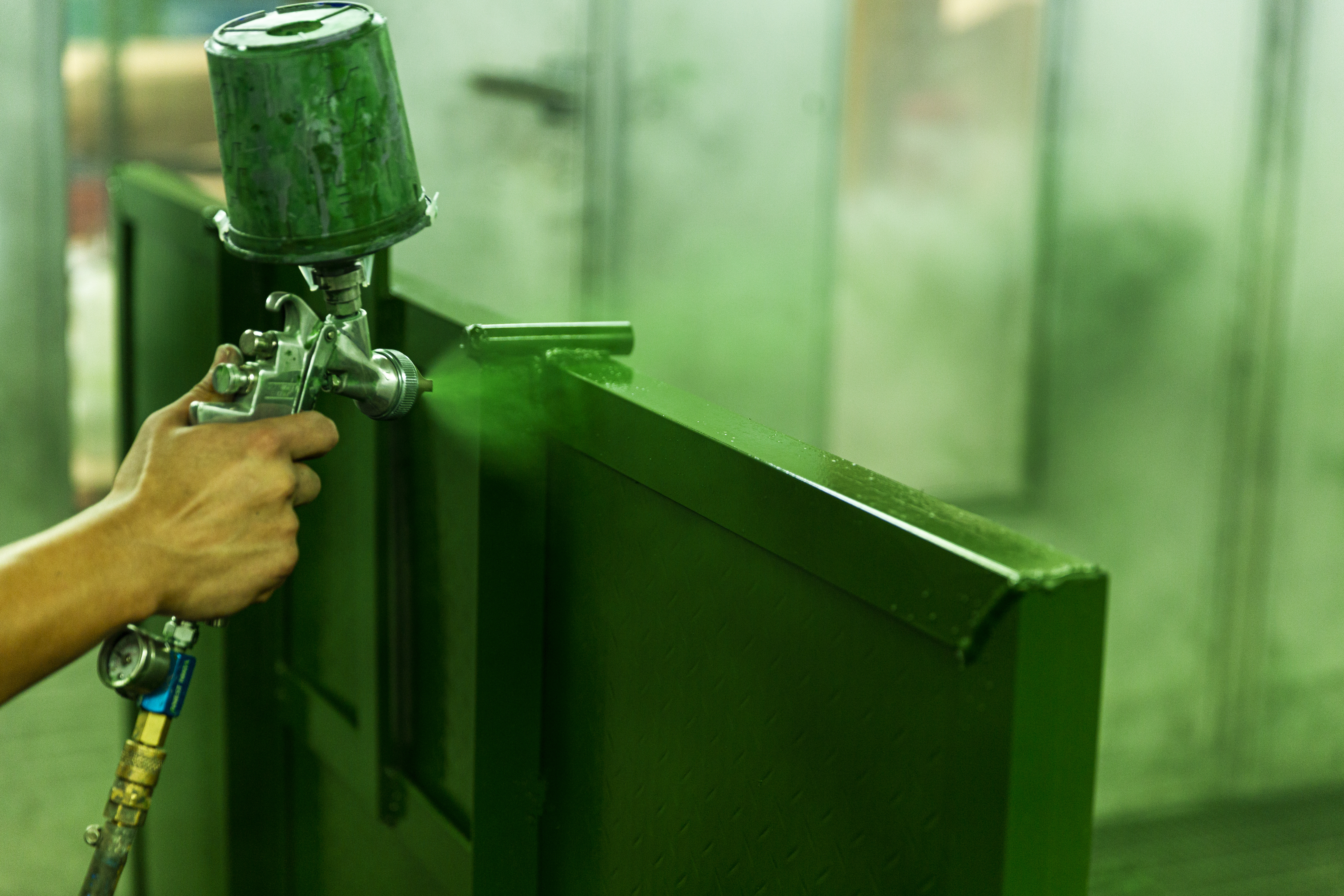 Green metal paint with spraying machine